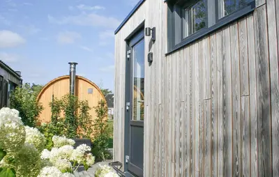 an open door of a house with a garden at Lovely Home In Oostwoud With Wifi in Oostwoud