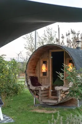 a small wooden dog house with a couch in it at Life Contains Beautiful Things in Almere