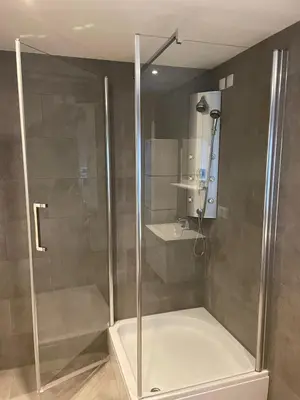 a shower with a glass door in a bathroom at Luxury City Home Alkmaar nearby Amsterdam. in Alkmaar