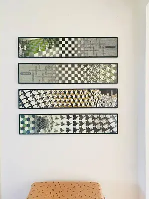 a wall with four pictures of checkered patterns on it at 30 steps to sand.. Light and spacious family villa in Zandvoort