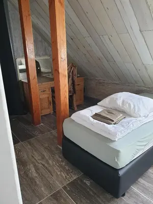 a bedroom with a bed in a attic at Landlust in Purmerend