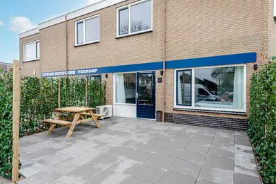 a picnic table in front of a building at Kings Square in Zandvoort