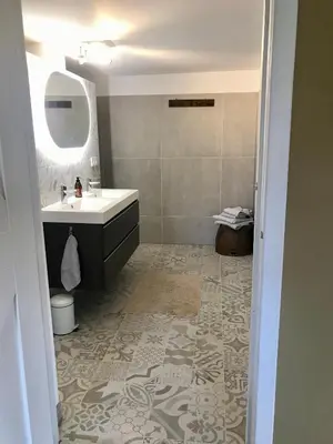 a bathroom with a sink and a mirror at Smederij Abbekerk, guesthouse in Abbekerk