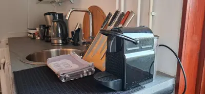 a kitchen counter with a mixer and a sink at StudioRandijk in Nieuwegein
