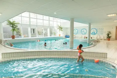 a woman walking in a swimming pool at Marinapark Volendam in Volendam