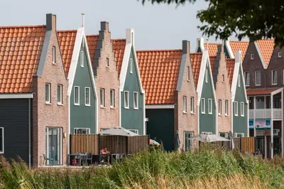 a row of houses with orange roofs at Marinapark Volendam in Volendam